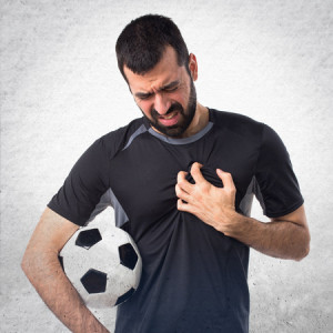 52648934 - football player with heart pain